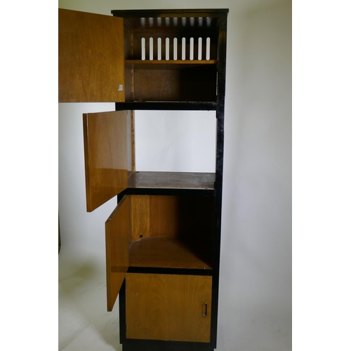 1214 - A bespoke mid-century cherry wood and black lacquer media cabinet of four cupboards, 56 x 49 x 193cm