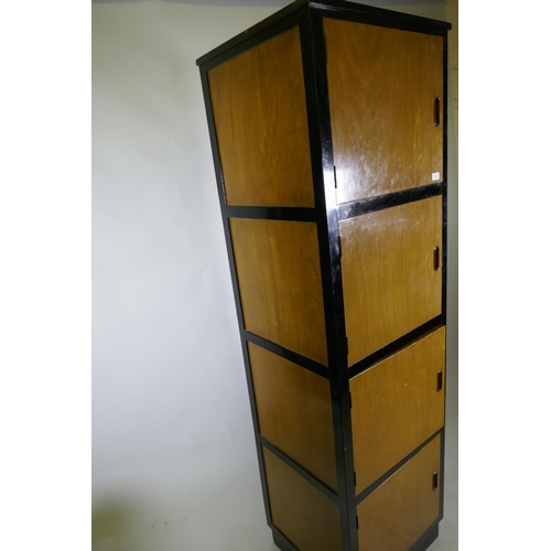 1214 - A bespoke mid-century cherry wood and black lacquer media cabinet of four cupboards, 56 x 49 x 193cm