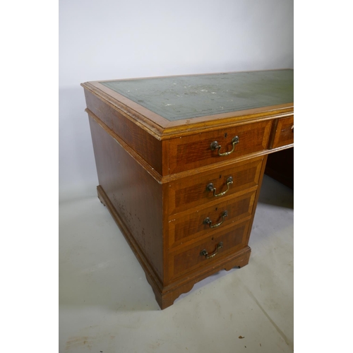 1226 - A Georgian style mahogany pedestal partner's desk, with nine drawers and two cupboards, brass swan n... 