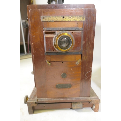 123 - A Thornton Pickard Standard plate camera, with tripod supports, mahogany plate cases, a Coronet Enla... 