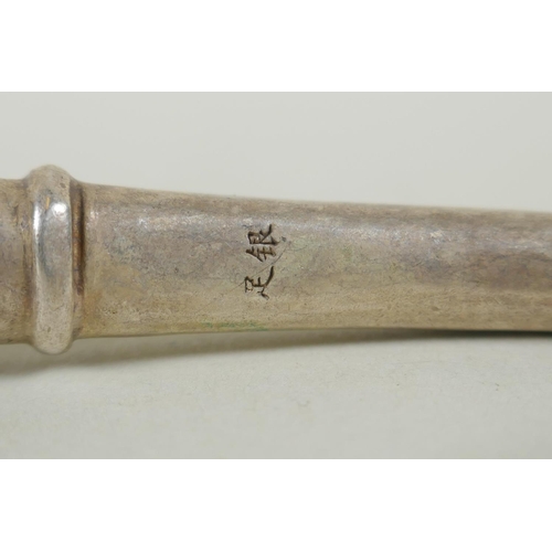 131 - A Chinese white metal pipe with dragon head decoration, 10cm