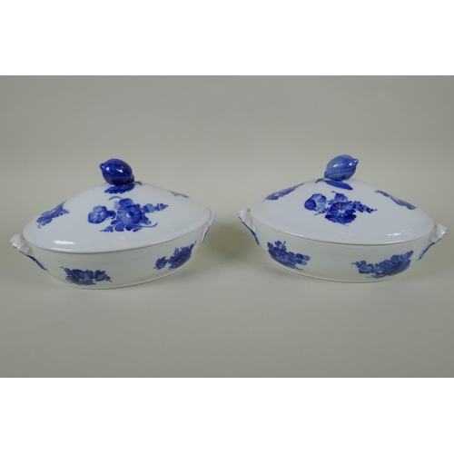 132 - A pair of Royal Copenhagen blue and white porcelain tureens with floral decoration and lemon knops, ... 