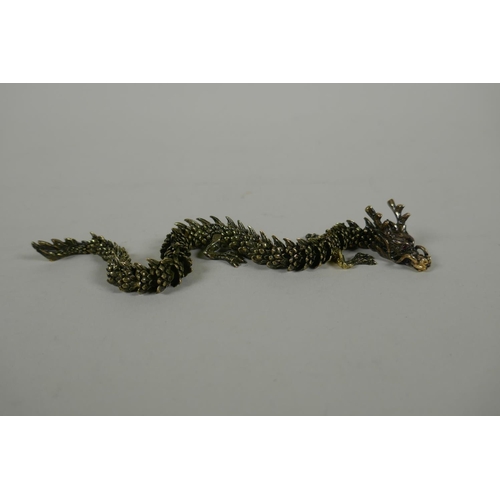 147 - A Japanese Jizai style articulated bronze okimono dragon, 22cm long