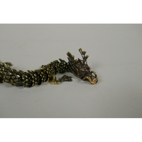 147 - A Japanese Jizai style articulated bronze okimono dragon, 22cm long