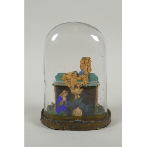 149 - A Victorian wax nativity scene in a hand blown glass dome, 14cm high