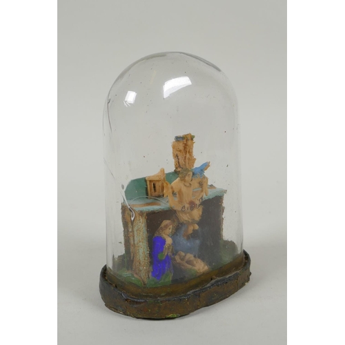 149 - A Victorian wax nativity scene in a hand blown glass dome, 14cm high