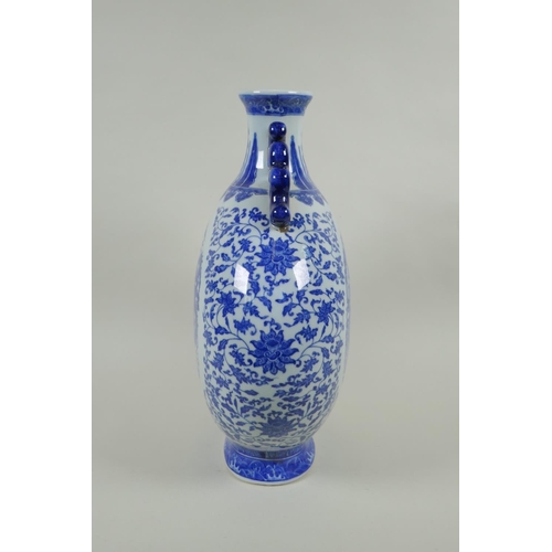 150 - A Chinese blue and white porcelain two handled moon flask, decorated with dragon, phoenix and lotus ... 