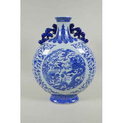 150 - A Chinese blue and white porcelain two handled moon flask, decorated with dragon, phoenix and lotus ... 