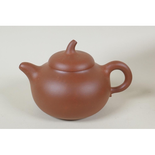 151 - A Chinese YiXing teapot with fitted box, silk bag and documentation, seal mark to base