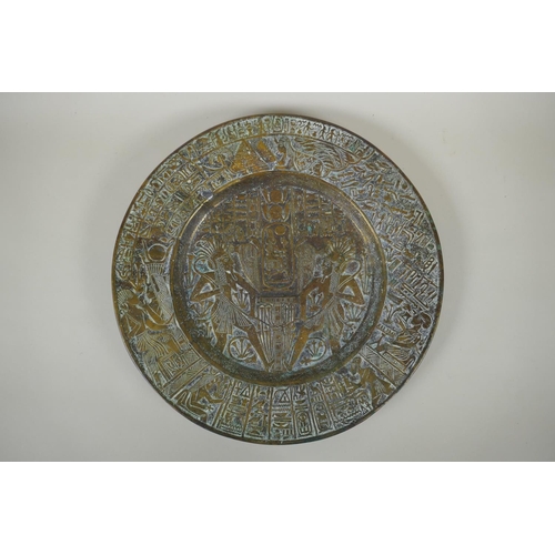 154 - An antique heavy Egyptian  bronze tray decorated with depictions of pharaoh and hieroglyphics, ... 