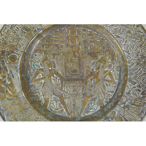 154 - An antique heavy Egyptian  bronze tray decorated with depictions of pharaoh and hieroglyphics, ... 