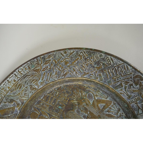 154 - An antique heavy Egyptian  bronze tray decorated with depictions of pharaoh and hieroglyphics, ... 