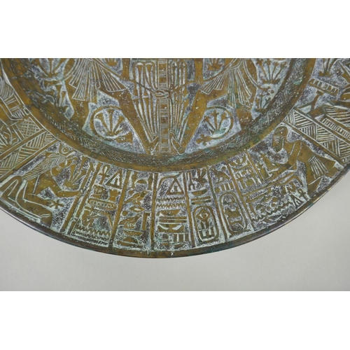 154 - An antique heavy Egyptian  bronze tray decorated with depictions of pharaoh and hieroglyphics, ... 