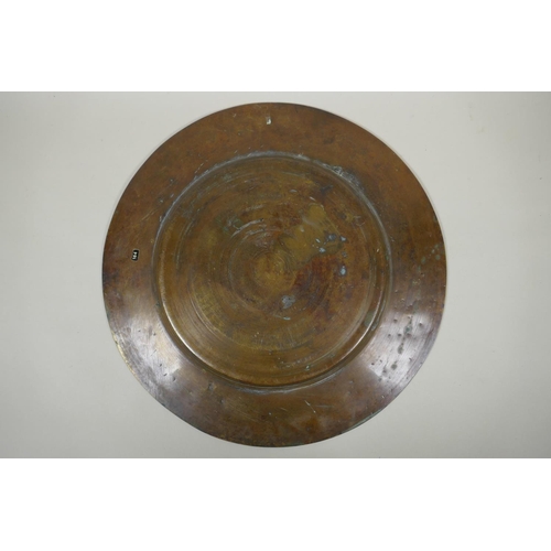 154 - An antique heavy Egyptian  bronze tray decorated with depictions of pharaoh and hieroglyphics, ... 