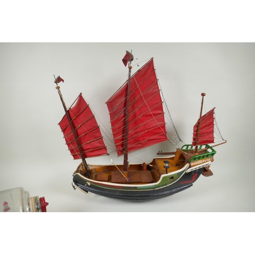 158 - A kit built model of the whaler Charles W. Morgan in a glass display case, a 1:48 scale model kit of... 