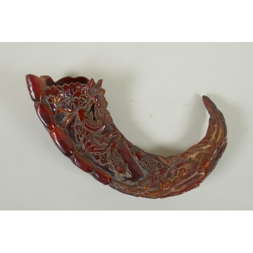 161 - A Chinese carved horn decorated with carp in a lotus pond, 20cm