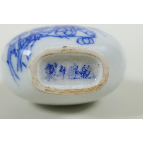 163 - A Chinese blue and white porcelain double gourd two handled snuff bottle decorated with birds amongs... 