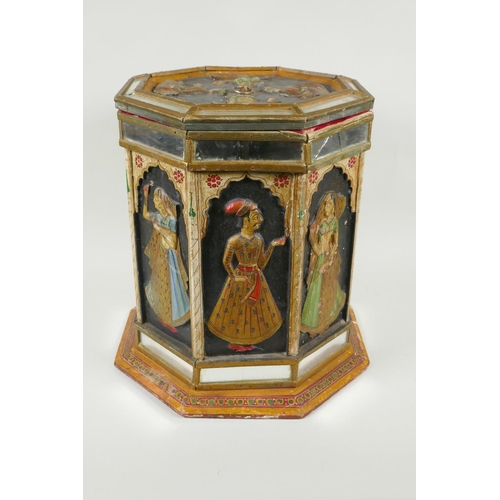 164 - An Indian hand painted carved wood hexagonal turban box set with mirror tiles, each panel decorated ... 