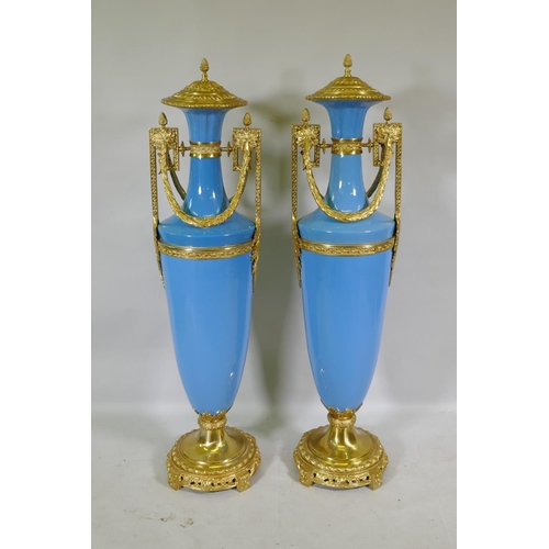 167 - A large pair of Sevres blue style ceramic urns with ormolu mounts, 135cm high