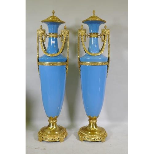 167 - A large pair of Sevres blue style ceramic urns with ormolu mounts, 135cm high