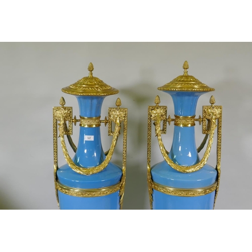 167 - A large pair of Sevres blue style ceramic urns with ormolu mounts, 135cm high