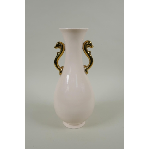 168 - A Chinese cream glazed porcelain pear shaped vase with two gilt handles and raised prunus decoration... 