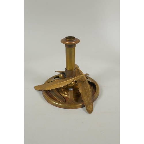 169 - A studio art coper and brass hand assembled candle stick, decorated with feathers, signed to the bas... 