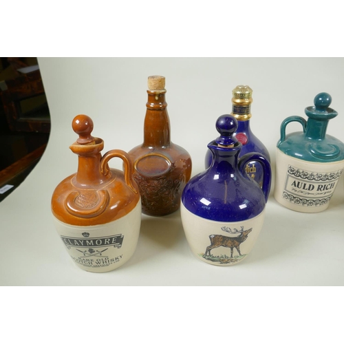 170 - Ten stoneware Whisky flagons, Claymore, Tullamore Dew, Long John, Glenfiddich, John Campbell etc