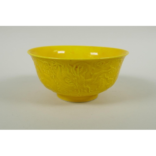 171 - A Chinese yellow ground porcelain bowl with raised dragon decoration, Yong Zheng 6 character mark to... 