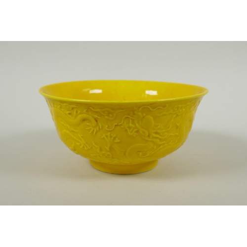 171 - A Chinese yellow ground porcelain bowl with raised dragon decoration, Yong Zheng 6 character mark to... 