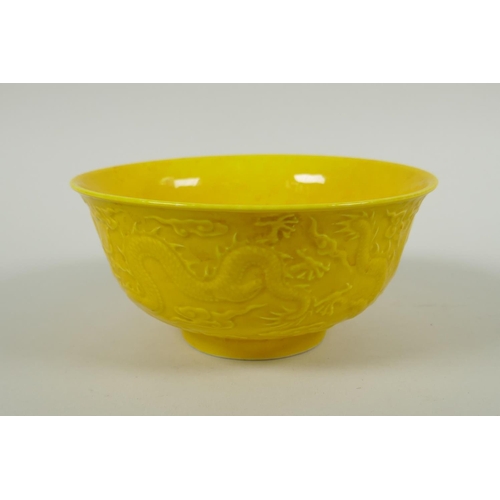 171 - A Chinese yellow ground porcelain bowl with raised dragon decoration, Yong Zheng 6 character mark to... 