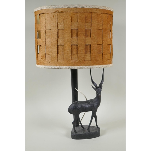 172 - An African carved hardwood antelope lamp, 56cm high