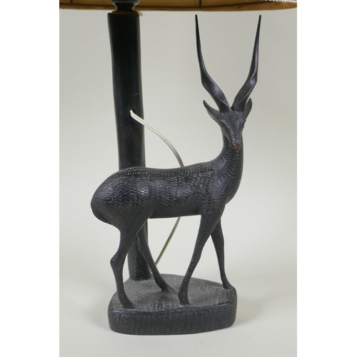 172 - An African carved hardwood antelope lamp, 56cm high