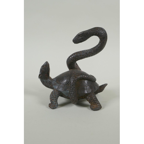 173 - A Chinese filled bronze figure of a tortoise entwined with a snake, with the remnants of gilt patina... 