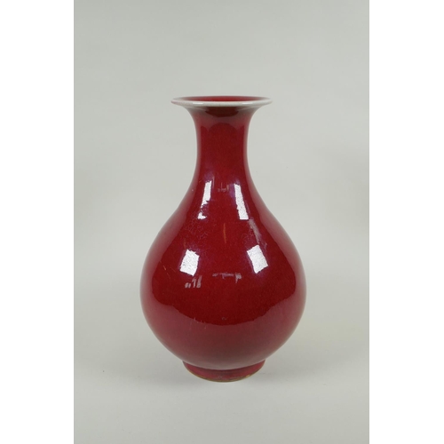 175 - A Chinese flambe glazed porcelain pear shaped vase, YongZheng 4 character mark to base, 33cm high