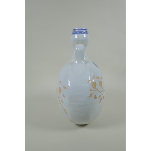 193 - A Chinese blue and white porcelain moon flask with two handles and chased decoration of birds on a b... 