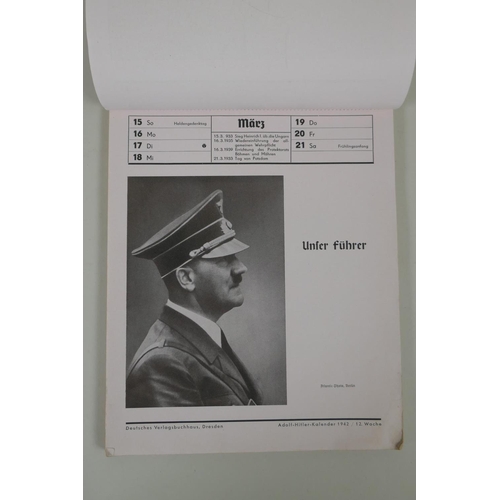 194 - A Third Reich 1942 Adolf Hitler 52 week wall calendar, each page with photographs of the leader, lac... 