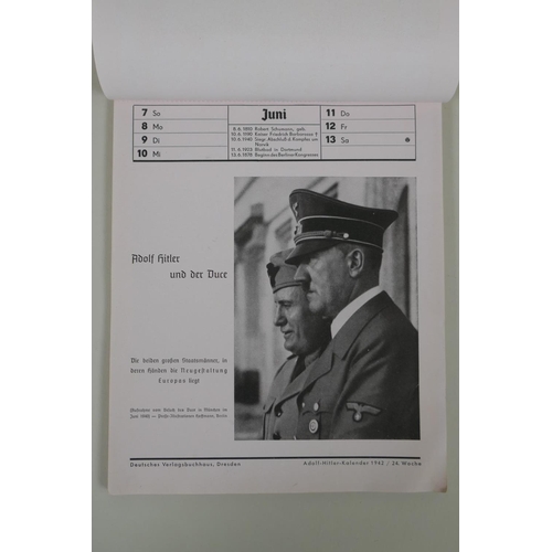 194 - A Third Reich 1942 Adolf Hitler 52 week wall calendar, each page with photographs of the leader, lac... 