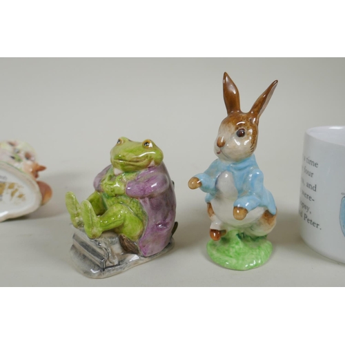 206 - A collection of Beatrix Potter related porcelain, to include six Beswick figurines, Peter Rabbit, Ta... 