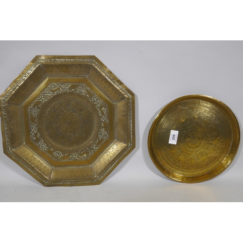 209 - An antique Indian brass tray with lion and elephant decoration, 76cm diameter and another smaller