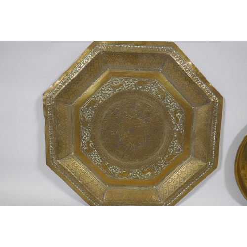 209 - An antique Indian brass tray with lion and elephant decoration, 76cm diameter and another smaller