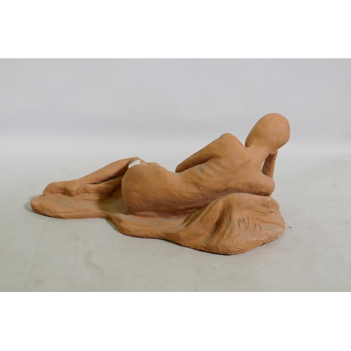 21 - A terracotta sculpture of a reclining nude, inscribed MJ 94, 46 x 21cm