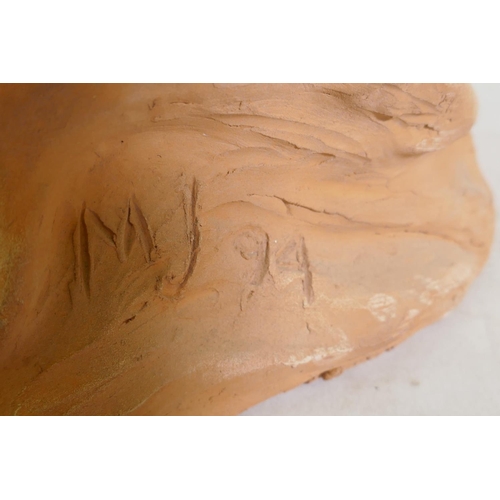 21 - A terracotta sculpture of a reclining nude, inscribed MJ 94, 46 x 21cm