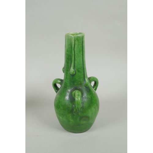 212 - A pair of green glazed Farnham Pottery vases with loop handles, AF, 19cm high