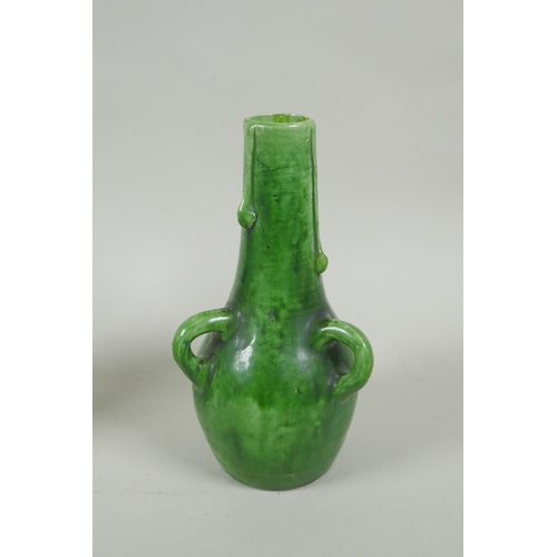 212 - A pair of green glazed Farnham Pottery vases with loop handles, AF, 19cm high