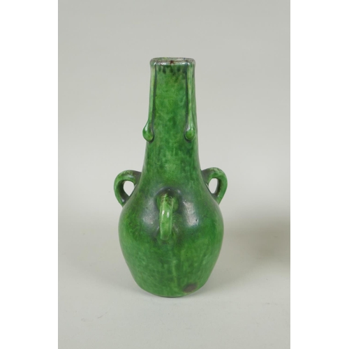 212 - A pair of green glazed Farnham Pottery vases with loop handles, AF, 19cm high