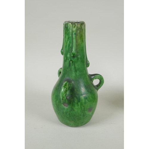 212 - A pair of green glazed Farnham Pottery vases with loop handles, AF, 19cm high