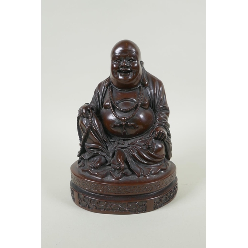 214 - A Chinese bronzed composition figure of a jolly Buddha, 23cm high