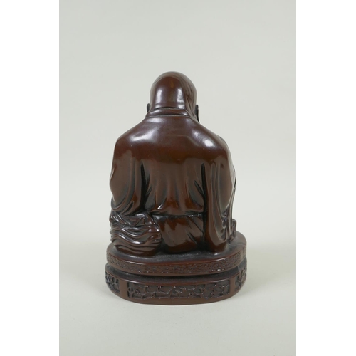 214 - A Chinese bronzed composition figure of a jolly Buddha, 23cm high