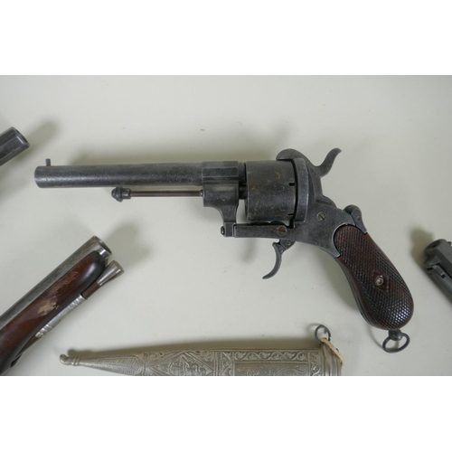 216 - Five replica pistols, including a French Lefaucheux pinfire revolver and a Colt model 1851, and two ... 